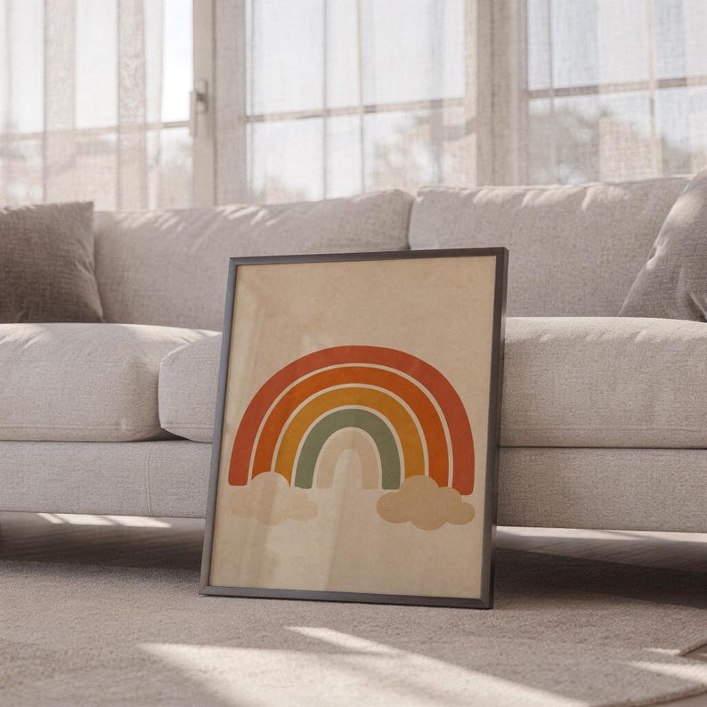 Boho earth tone rainbow print leaning against a white sofa in a bright living room with sheer curtains.