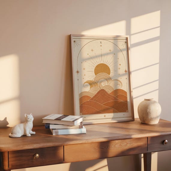 Mid century terracotta desert landscape poster on wooden desk with warm sunlight and ceramic vase.