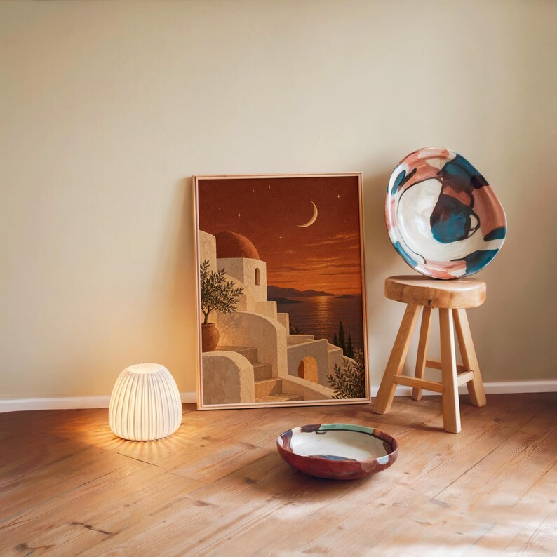 Print size guide for the mediterranean moonlit coastal wall art print: framed examples in 12x16, 16x20, 18x24, 23.4x33.1 and 24x36 inches on a warm beige wall above a cream sofa; 14 sizes available from 5x7 to 36x48 inches, prints ship unframed.