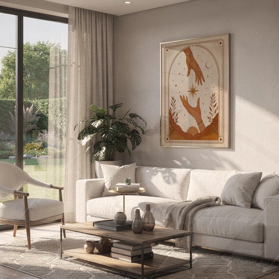 Aesthetic boho celestial hands poster hanging on wall above sofa in bright living room.