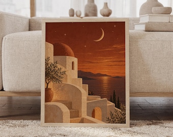 May include: A rectangular framed wall art print featuring a Mediterranean coastal scene at sunset. The image displays white stucco buildings with a domed roof, a potted olive tree, a crescent moon, and stars against a deep orange sky over water.