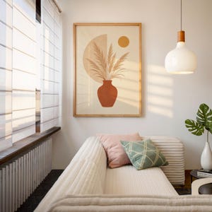 Warm aesthetic pampas grass art displayed in sunlit cozy interior room