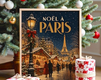 Könnte beinhalten: Ein rechteckiger gerahmter Druck mit einer verschneiten Pariser Weihnachtsszene, dem Eiffelturm im Hintergrund und dem Text NOËL À PARIS. Der Druck wird mit zwei weißen Geschenkboxen in rot gemustertem Papier präsentiert.