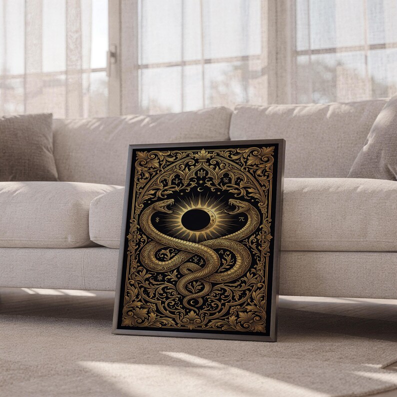 Occult snake wall art print leaning against a white sofa in a bright living room with sheer curtains.
