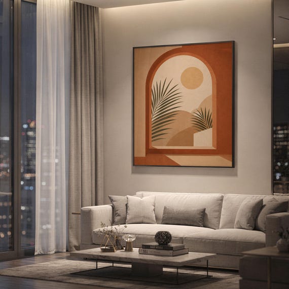 Terracotta arch wall art framed on wall behind sofa in spacious modern apartment at night decor.