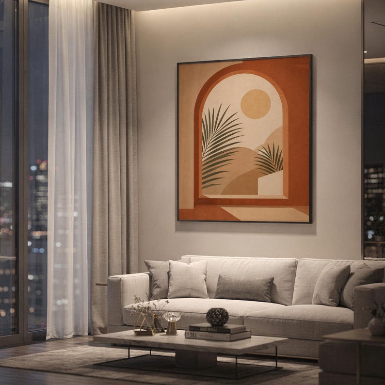 Terracotta arch wall art framed on wall behind sofa in spacious modern apartment at night decor.