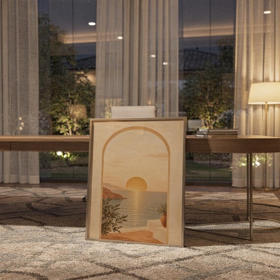 Mediterranean sunset arch print hanging above a stone countertop with a fruit bowl in a sunny kitchen.