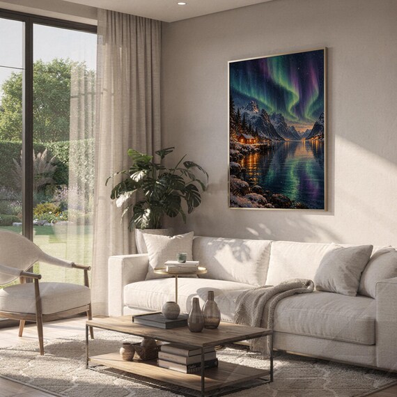 Aurora borealis mountain landscape wall art print hanging above a white sofa in a living room with garden views.