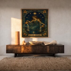 The star tarot card wall art print hanging above a dark wood console and jute rug in a warm neutral interior.