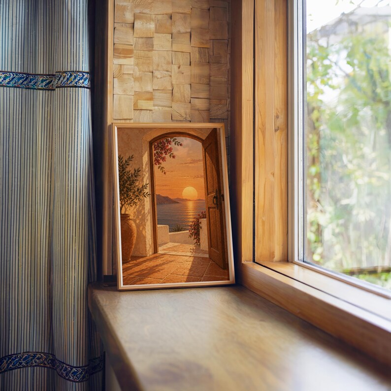 Mediterranean sunset doorway wall art print standing on a wooden window sill in warm natural light.