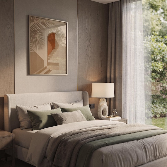 Minimalist boho architectural art print framed above bed in cozy bedroom