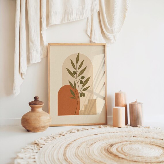 Minimalist olive branch wall art with terracotta arches on bohemian floor setup