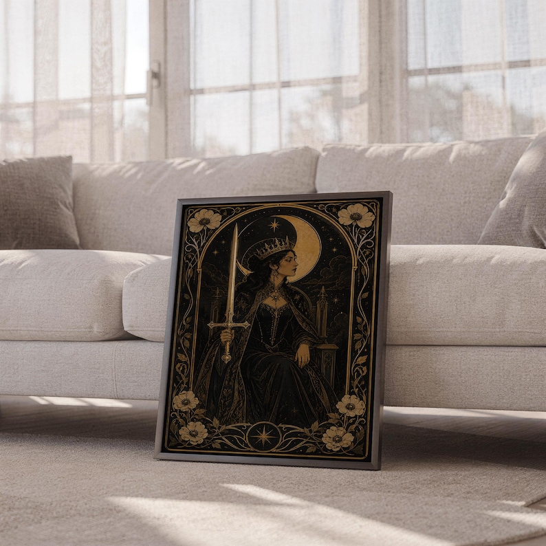 Gothic moon queen wall art print leaning against a white sofa in a bright living room with sheer curtains.
