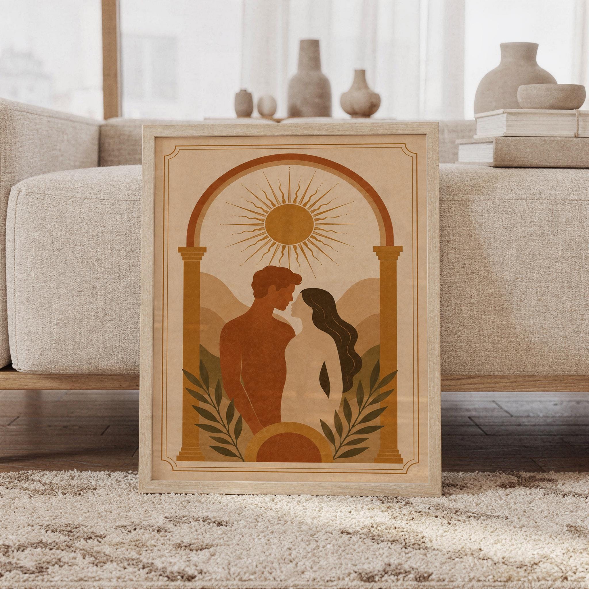 Framed boho romantic couple silhouette wall art in terracotta tones, resting on a rug beside a beige sofa in natural daylight.