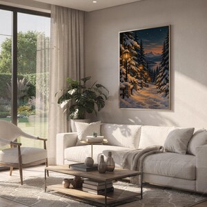 Snowy forest path wall art print hanging above a white sofa in a living room with garden views.