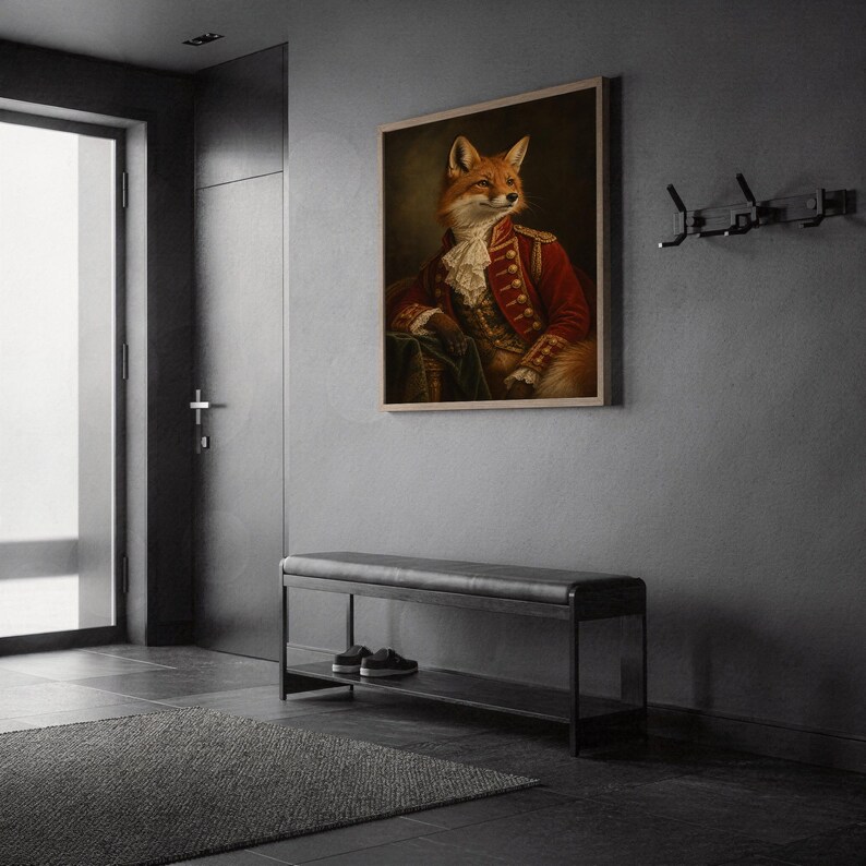 Fox portrait wall art print in a silver frame leaning against a sofa beside a decorative marble sphere.