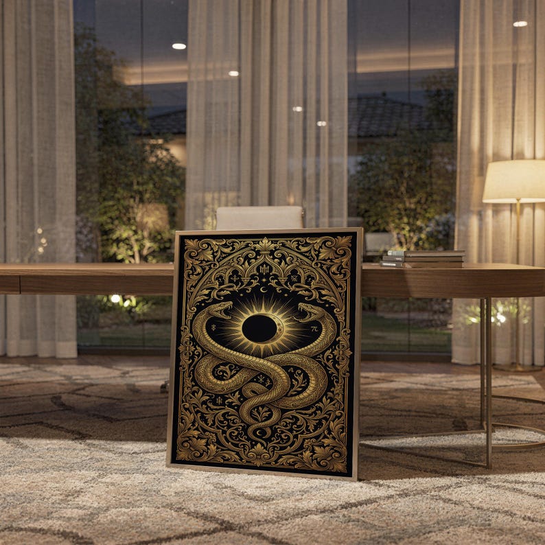 Occult snake wall art print standing on a wooden desk in a home office in warm evening light.