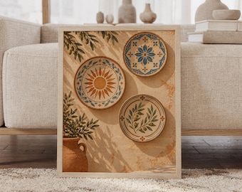 May include: A framed wall art print featuring three circular decorative plates arranged on a textured beige background. The plates display a sunburst pattern, a blue floral motif, and an olive branch design, alongside a terracotta vase.