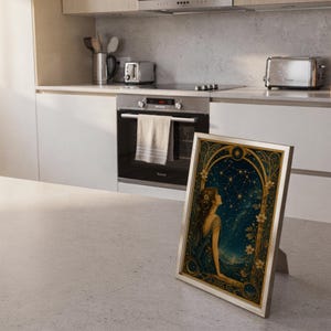 Celestial woman wall art print framed and displayed in a modern home interior.