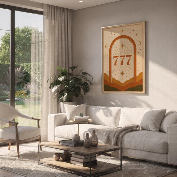 Terracotta 777 angel number art hanging on a bright living room wall above a modern sofa and coffee table with houseplants.