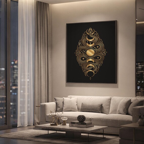 Gold snake moon phase wall art print hanging above a light gray sofa in a modern living room with evening city views through tall windows.