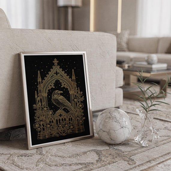 Gothic raven wall art print standing on a countertop in a modern white kitchen.