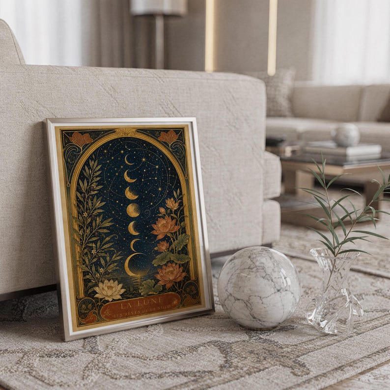 Moon phase wall art print standing on a countertop in a modern white kitchen.