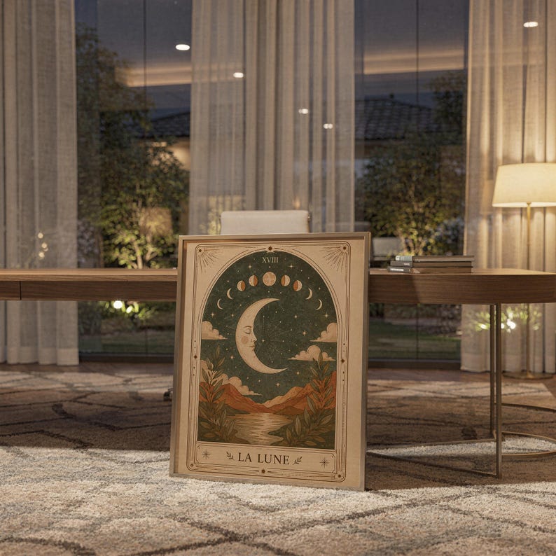 La Lune moon tarot card art print framed on desk in modern home office at evening time.