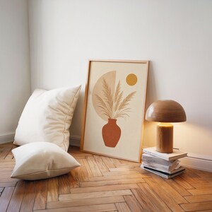 Terracotta vase botanical poster leaning on floor with floor lamp and cushions
