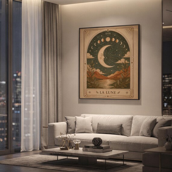 Mystical tarot card print framed on wall behind white sofa in spacious modern apartment.