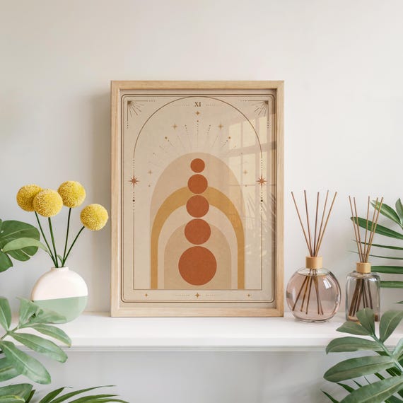 Terracotta boho geometric arch poster framed on white shelf with yellow flowers and diffuser.