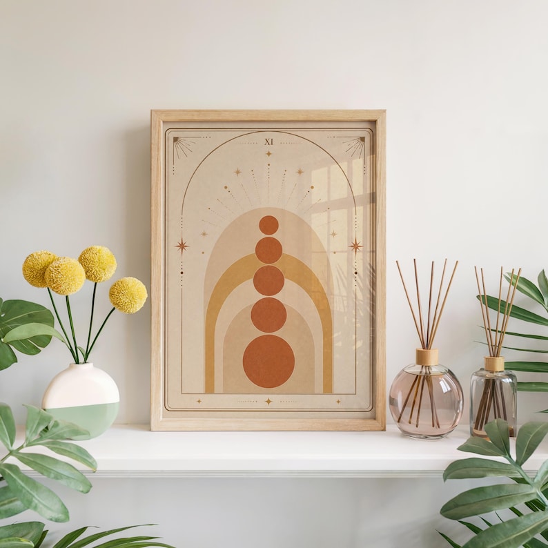 Terracotta boho geometric arch poster framed on white shelf with yellow flowers and diffuser.