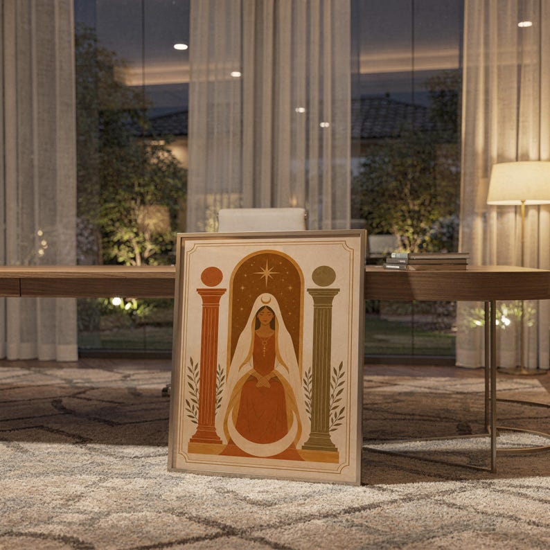 Terracotta vase and arch print in a sleek frame resting on the floor in a cozy evening dining space.