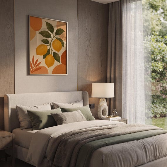 Lemon branch botanical print hanging above a bed with sage green pillows in a calm neutral bedroom.