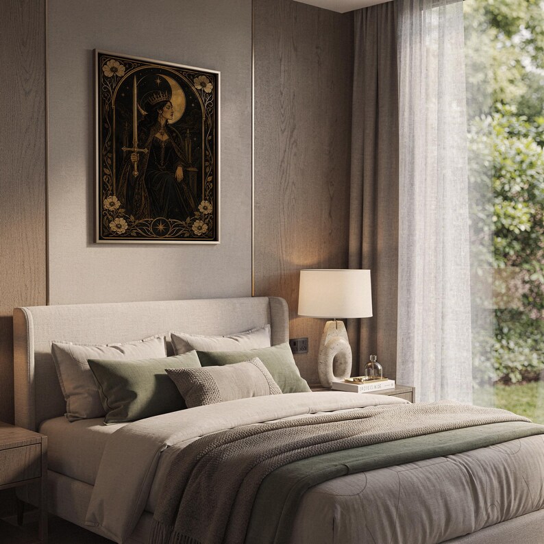 Gothic moon queen wall art print hanging above a bed with sage green pillows in a calm neutral bedroom.