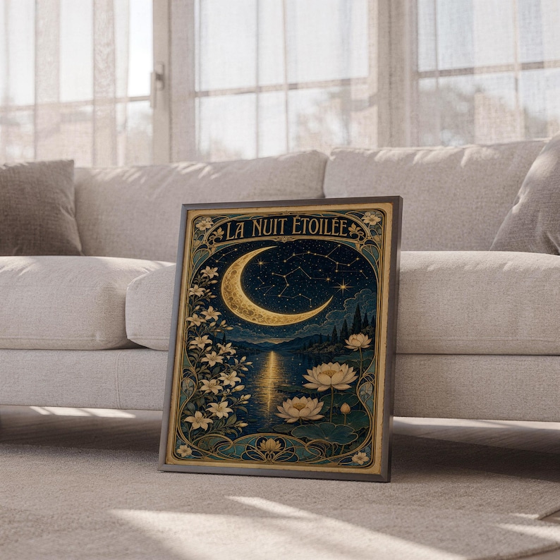 A framed Art Nouveau moon poster leans against a light fabric sofa.
