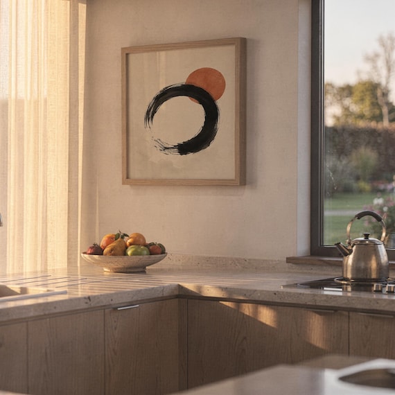 Minimalist terracotta sun and Enso circle print hanging on sunny kitchen wall