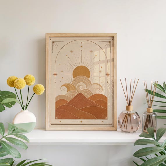 Terracotta boho waves and sun tarot card poster framed on white shelf with yellow flowers and room diffuser.