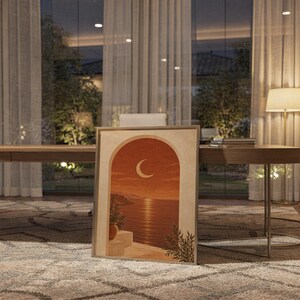 Mediterranean crescent moon arch print standing on a wooden desk in a home office in warm evening light.