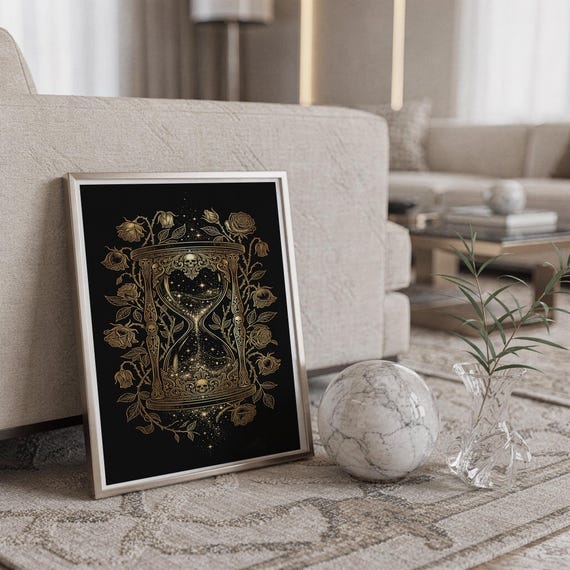 Gothic hourglass wall art print standing on a countertop in a modern white kitchen.