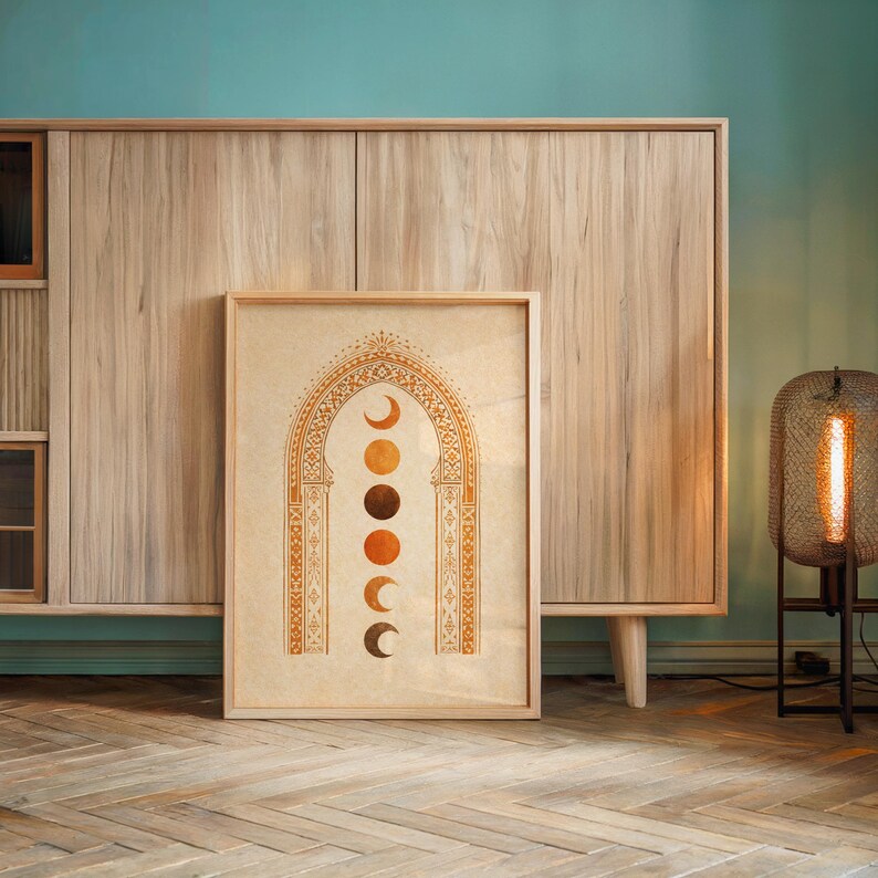 Boho terracotta wall decor poster styled on a minimalist wooden sideboard cabinet with ambient indoor lighting⁠