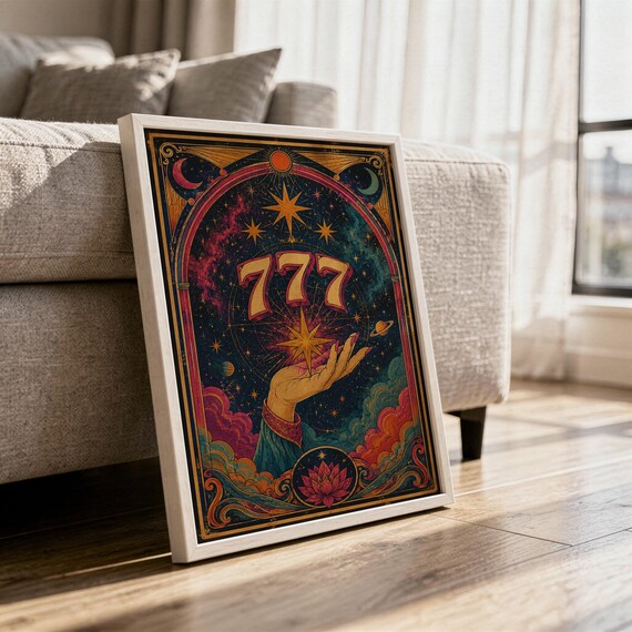 777 angel number wall art print in a white frame leaning against a gray sofa on a sunlit wooden floor.