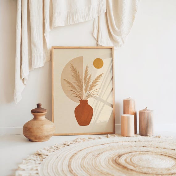 Pampas grass art in terracotta vase framed on floor in bohemian room setup