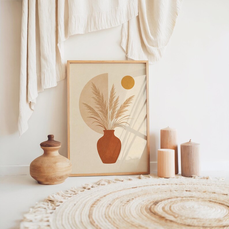 Pampas grass art in terracotta vase framed on floor in bohemian room setup