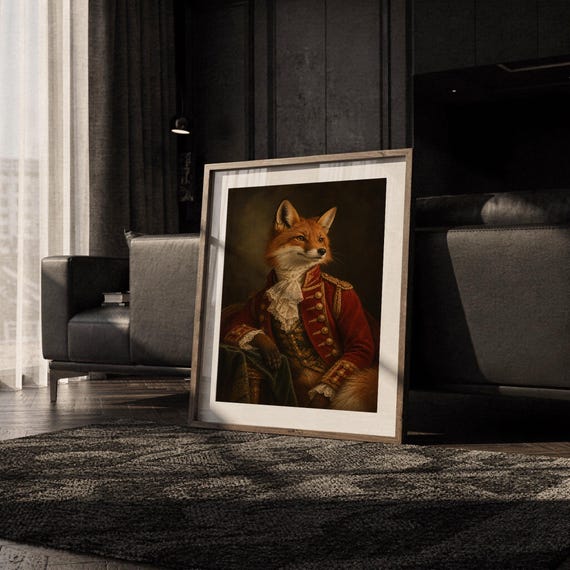 Fox portrait wall art print leaning on the floor beside a cream armchair next to large garden windows.
