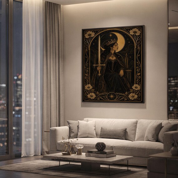 Gothic moon queen wall art print hanging above a light gray sofa in a modern living room with evening city views through tall windows.