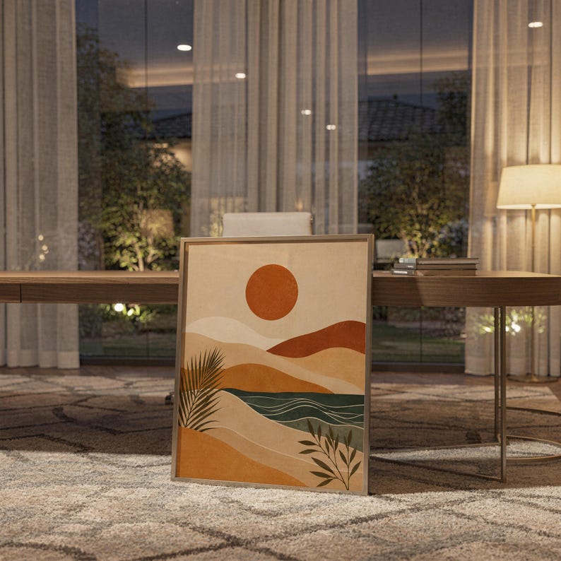 Modern abstract landscape poster framed and leaning on wooden floor next to floor lamp in living room.