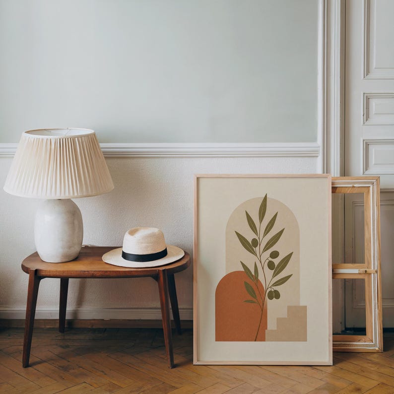 Boho botanical art print framed on wooden side table in minimalist living room