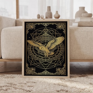 Celestial owl wall art print featuring a golden flying owl, zodiac symbols, astrological charts, sacred geometry, and ornate botanical borders on a deep black background, framed and leaning against a beige sofa on a textured rug in a bright Scandinavian living room.