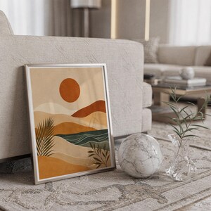 Aesthetic boho abstract landscape poster framed on wall above a cozy bed in bedroom.